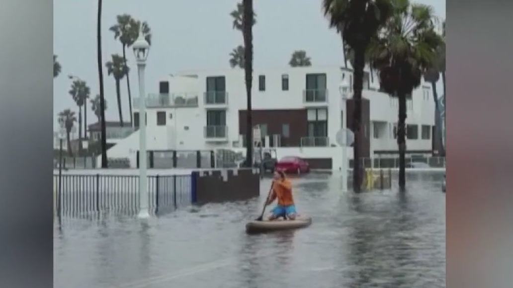 San Diego residents paddle through flooded streets